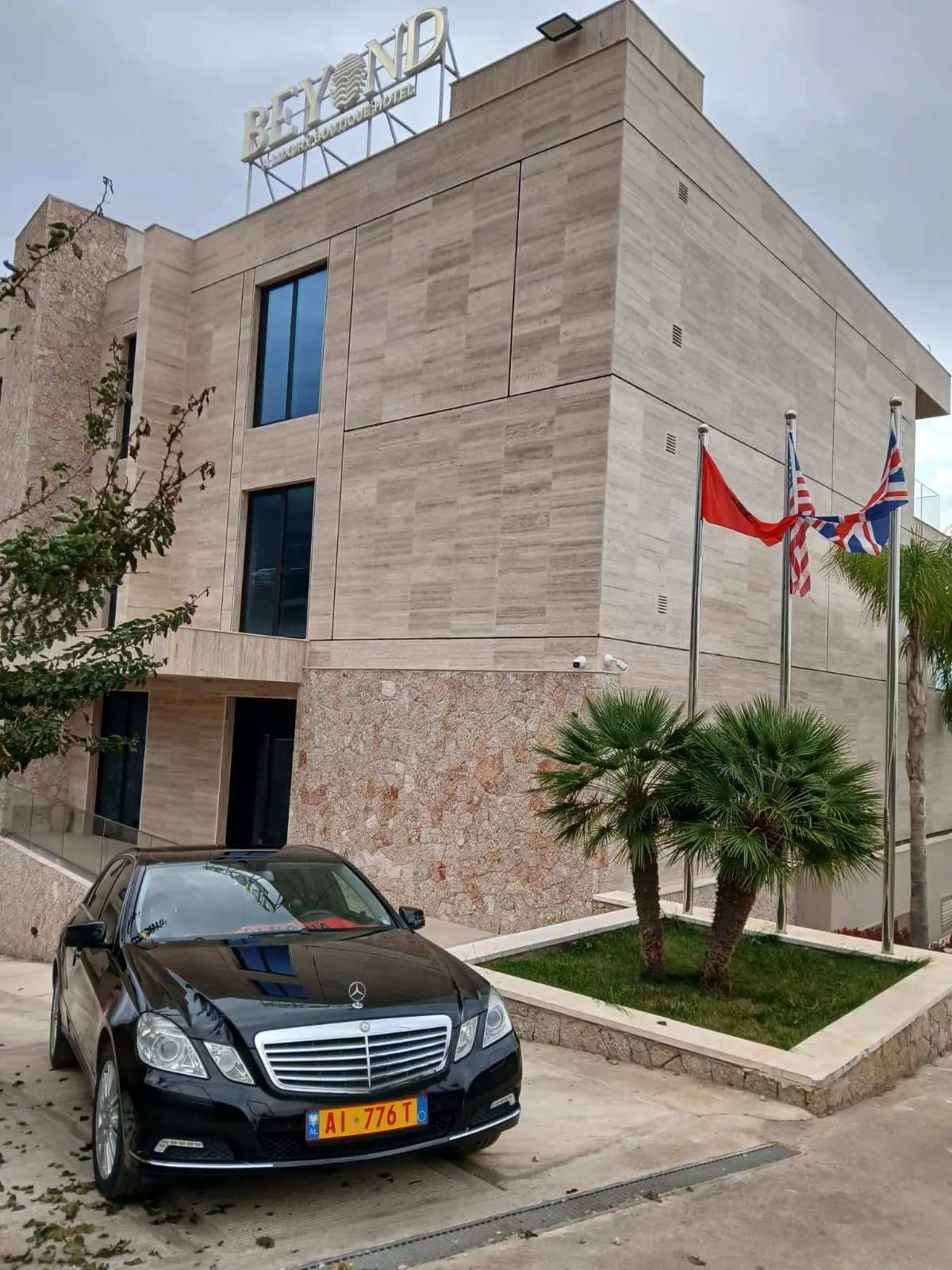 The taxi waiting at a hotel entrance for a booked pickup
